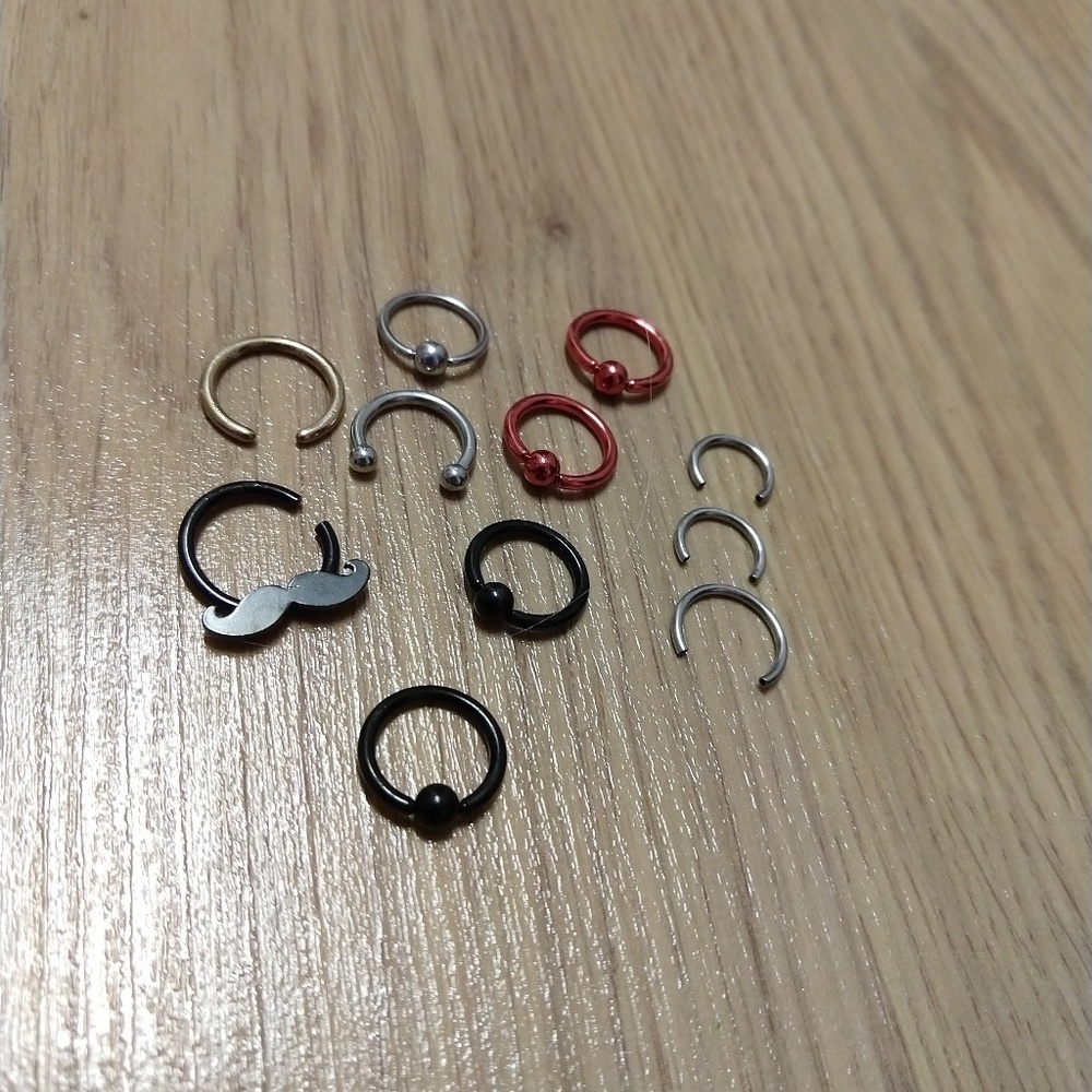 Variety of piercings, septum or eyebrow or else
